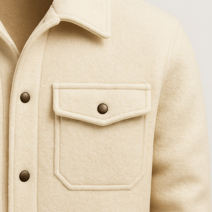 Men’s wool-style jacket with snap-button front, structured collar, and dual chest flap pockets.
