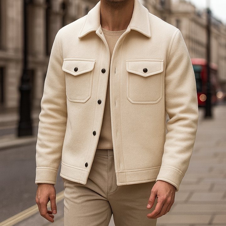 Men’s wool-style jacket with snap-button front, structured collar, and dual chest flap pockets.