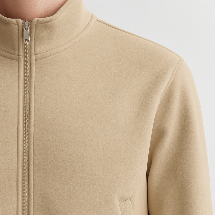 Men’s zip-up jacket with high collar, welt pockets, and ribbed cuffs and hem.