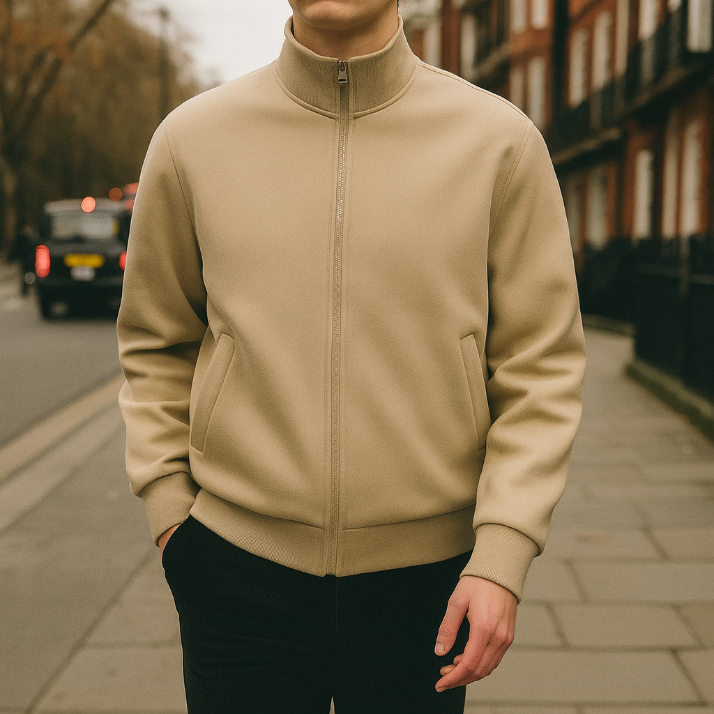 Men’s zip-up jacket with high collar, welt pockets, and ribbed cuffs and hem.