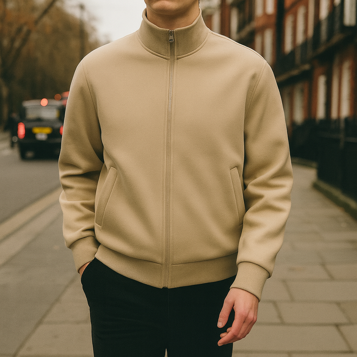 Men’s zip-up jacket with high collar, welt pockets, and ribbed cuffs and hem.