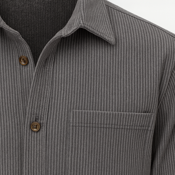 Men’s button-up shirt with vertical stripes, chest patch pockets, and long sleeves.
