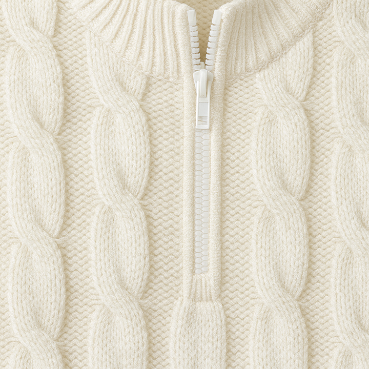 Cable-knit sweater with a half-zip stand collar.