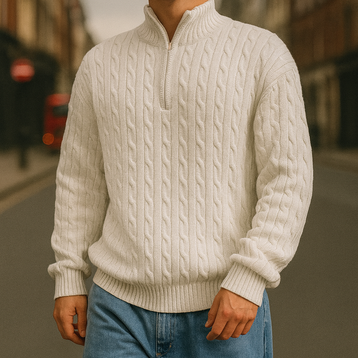 Cable-knit sweater with a half-zip stand collar.