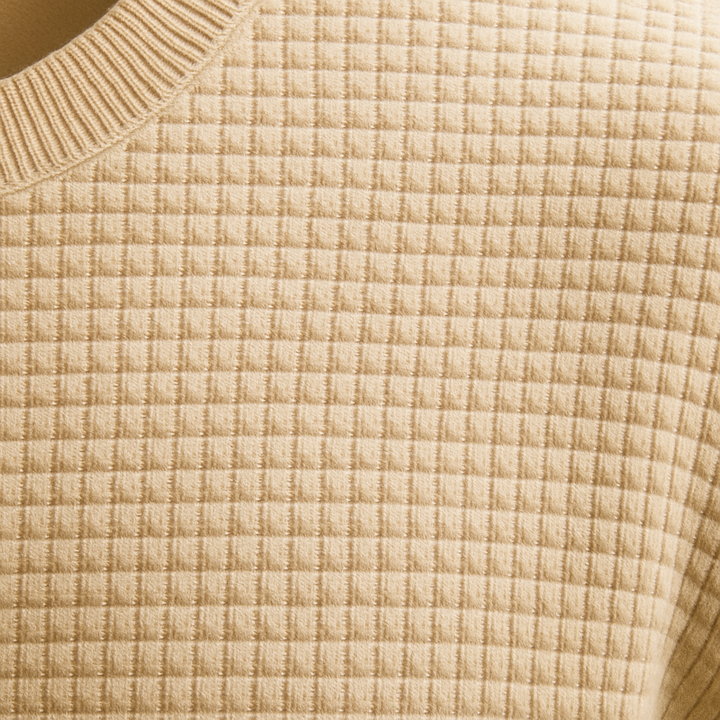 Long-sleeve textured knit sweater.